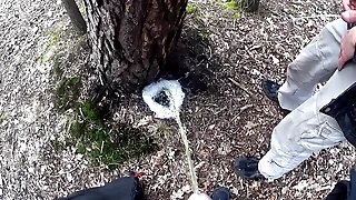 boys pissing together a big foamy puddle readily obtainable a tree