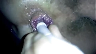 candle inserted alongside ass while peeing alongside thermos
